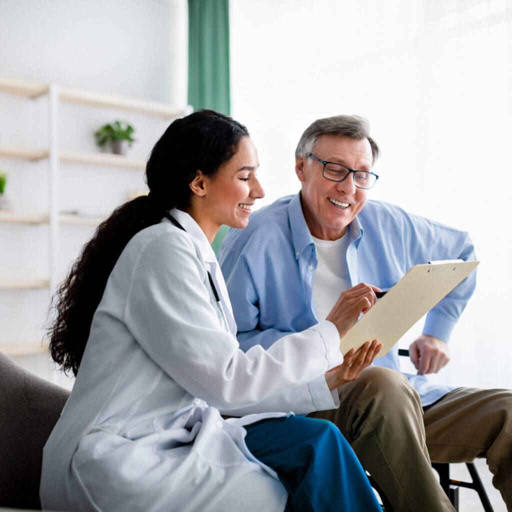 A nurse explains healthcare options to a patient.